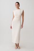 Woman wearing a white ruched modal sleeveless midi dress.