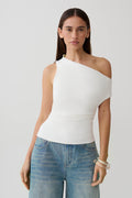 Woman wearing a white short sleeve draped hardware top.