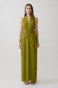 Woman wearing a green satin halter maxi dress.